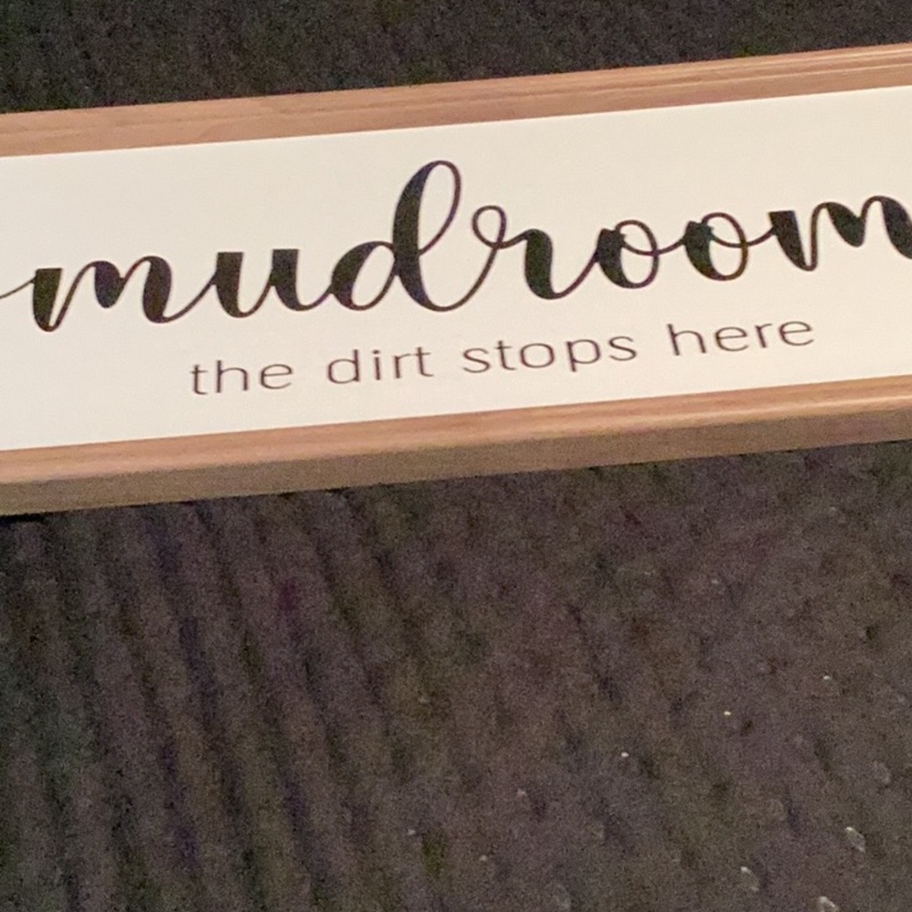 Large sign says MUDROOM the dirt stops here